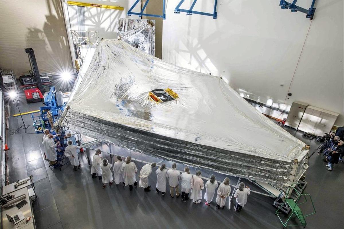 The first test of a kite-shaped sunscreen film for the James Webb Space Telescope (JWST) at Northrop Grumman's facility in Redondo Beach, California in July 2014.