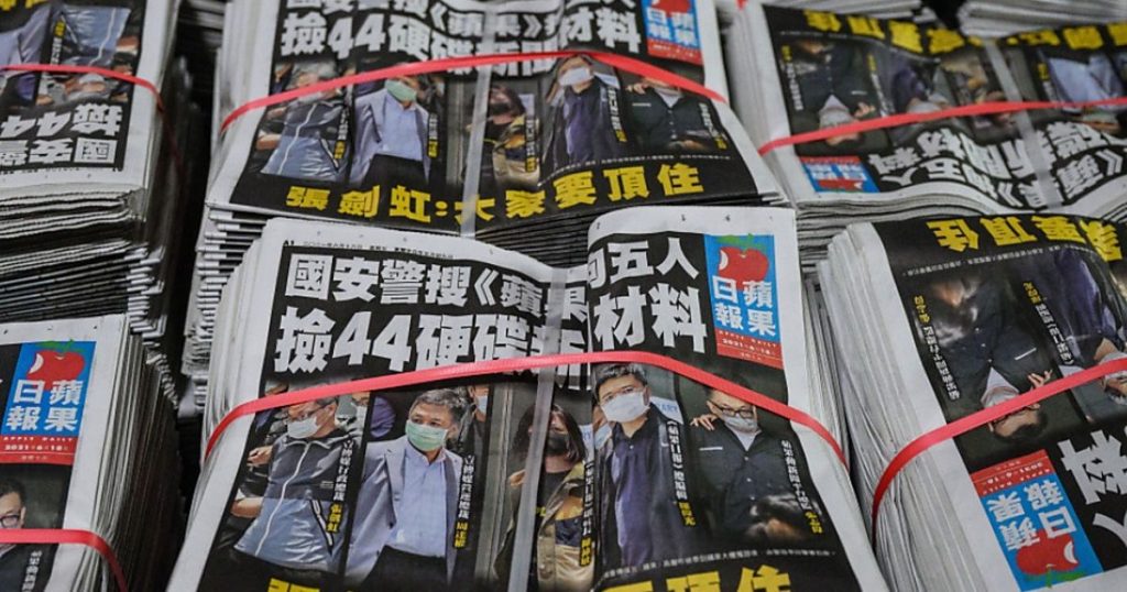 Hong Kong newspaper employee accused