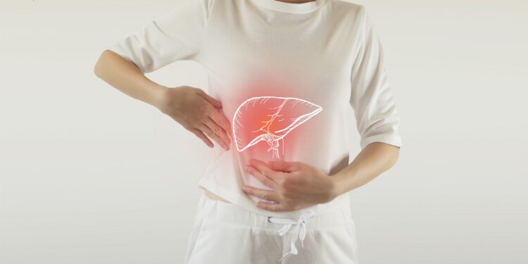 Digitally depicted red liver on the abdomen of a woman wearing white