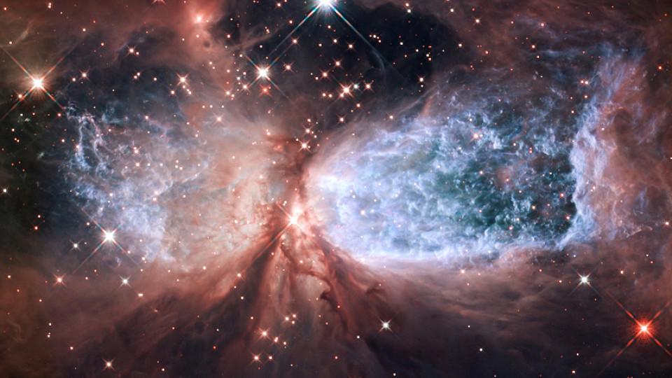 Image #: 16674145 Hubble Presents a Snow Angel on Holiday.  The bipolar star-forming region, called Sharpless 2-106, looks like a soaring celestial snowy angel.  the outstretched "wings" The nebula records the contrasting signature of heat and motion