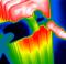 Thermal image of a person's hand adjusting the coolant temperature.