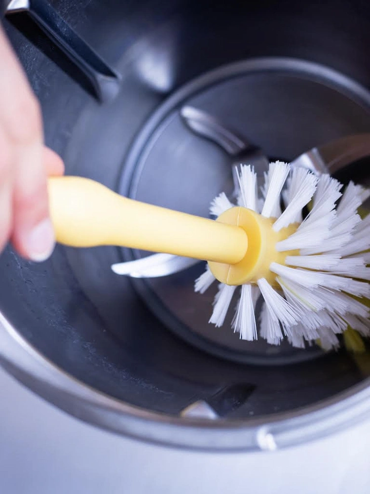 Use a soft-bristled bottle brush and clean the Thermomix cooker bowl