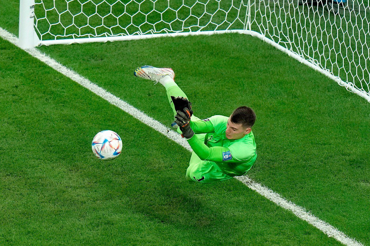 Croatia goalkeeper Dominik Levakovic saves a penalty kick